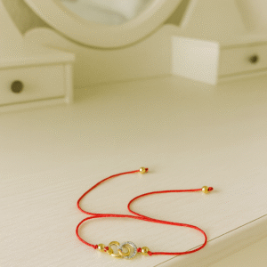 pulsera hilo rojo unión dorada