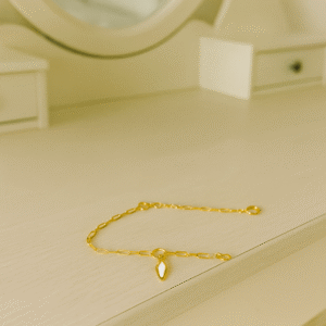 tobillera dorada hoja de luz con huesito de nácar